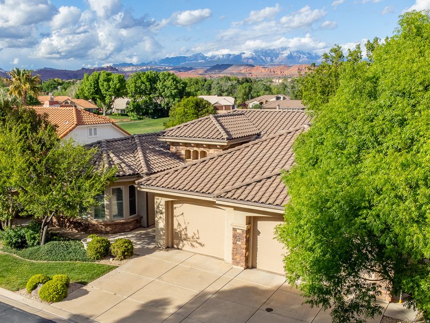 Located in the Crystal Springs neighborhood of Sunbrook, this home enjoys incredible golf course views overlooking the lake and fairway of the beautiful 7th hole, and beyond toward Pine Valley Mountain. But the floor plan is where this home really shines. Great, open layout with a spacious great room and a large kitchen featuring abundant cabinetry. Storage is a true highlight, from the oversized pantry and generous laundry room to the well-thought-out storage throughout. Natural light fills the home, and the private patio is the perfect place to take in the views and quiet surroundings. Gently used as a second home, it's been exceptionally well cared for and is in great condition. A 3-car garage adds flexibility, and the location on a tucked-away street with mature trees only adds to the appeal. Homes in this area don't last long -- and this one checks all the right boxes.