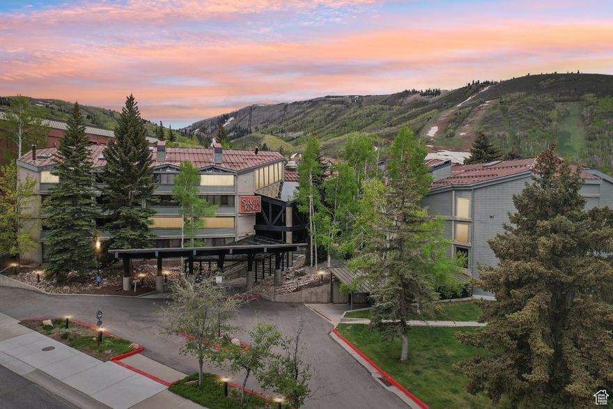 Located steps from the Park City Mountain Resort ski lifts, this Silver King condo offers unmatched convenience for skiing and easy access to Main Street. The fully furnished, turn-key residence includes granite countertops, an in-unit washer/dryer, and HOA dues that cover all utilities.  This roomy two bedroom unit has mountains and ski run views. The property is accompanied by an underground parking garage and a variety of quality amenities designed for relaxation, including a beautiful indoor/outdoor heated swimming pool, sauna, hot tub, a fully equipped gym, and ski locker room. Also, enjoy the added benefit of being on the free Park City bus line, providing quick access to Park City's vibrant historic district, fine dining, boutique shopping, and cultural events. This mountain getaway combines the perfect blend of luxury, convenience, and an unbeatable location to make the most of everything Park City has to offer. Onsite management and front desk check-in add to the ease of ownership.