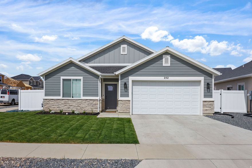 *** ALMOST BRAND NEW 1 LEVEL RAMBLER *** Perfectly situated just 15 minutes from Ogden and Brigham City, this home offers quick access to city amenities while being tucked into a quiet, peaceful setting. Enjoy the charm of small-town living along a scenic route known for local fruit stands and fresh seasonal produce. Located on a desirable corner lot, the property features a removable fence post for easy backyard access, ideal for trailers, vehicles, or additional parking.  This neighborhood has a beautiful view of Willard Bay. A safe, close-knit neighborhood where kids ride bikes, play outside, and neighbors genuinely look out for each other.