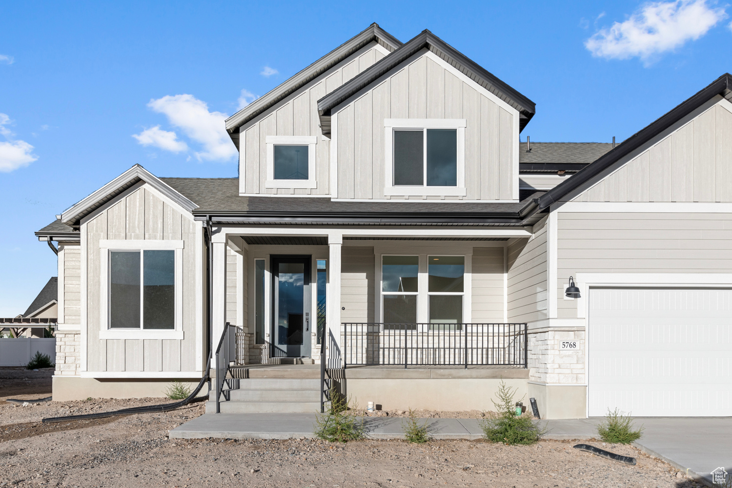 Come see this beautiful turn key Hamilton traditional home in a sought-after Stansbury Park community! This beautifully designed residence features a huge kitchen with elegant cotton maple cabinets with LED lighting, tile backsplash, stunning quartz kitchen countertops, and top-of-the-line stainless steel gas appliances with double ovens. The flooring is a tasteful mix of laminate hardwood, tile, and carpet, creating a welcoming and comfortable environment. The spacious 3-car garage ensures ample parking and storage, while a box bay window in the kitchen nook provides extra dining space. This home is equipped with a gas line to the dryer and a cozy gas log fireplace in the family room, perfect for those chilly evenings, while textured walls, two tone paint, and Entrada base and casing, all contribute to a sophisticated and modern appeal for any buyer! Come check it out today!