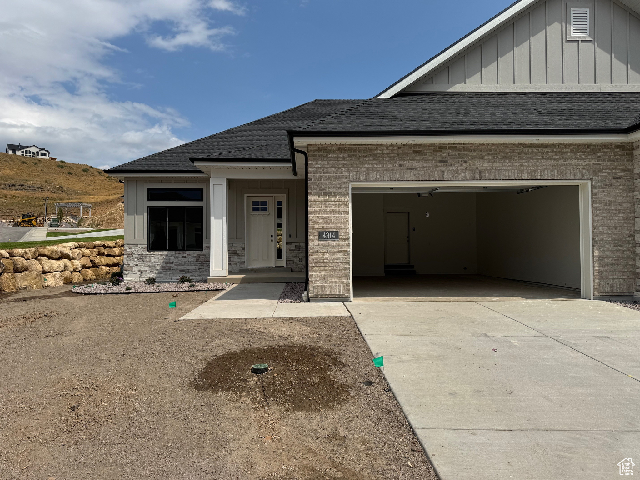 La Ringhiera Development is a Luxury Twin Home Development high up in Traverse Mountain Lehi. We are now in the final phase in the development, with this being the last Meriwood floor plan built. You will be amazed with the high-end finishes throughout this home. Main floor living includes 10' and 11' ceilings, with a tray celling in the main floor Family Room. Entering this luxury home, you can feel the upgraded features that make this an exceptional home. The beautiful chef kitchen cabinetry is a combination of stained white oak and painted cabinets, with stainless steel appliances including double ovens, microwave, dishwasher and 36" gas cooktop. The two gas log fireplaces provide warmth on each level during the winter. The Primary Bathroom includes double sink vanity, standalone tub, and a separate shower finished with custom tile and Euro Glass Frameless Shower Enclosure. The Primary Closet has a custom closet system with drawers and pull-down rods adding additional hanging space. You will notice the conveniently located separate laundry room on the main floor. The spacious basement includes a kitchenette with sink, microwave, and mini fridge, plus a large family room, two bedrooms, along with a 3/4 bathroom with upgraded tiled shower and Euro Glass Shower Door. In addition, the basement includes a large bonus space under the double car garage, for storage or one can choose to finish as a home theater room or rec room. This home also has a central vacuum system with all the tools and hose. The garage is completely finished and includes an epoxy floor and insulated garage door. Put away your lawnmower as the fully landscaped yard is maintained as part of the HOA services. Snow removal to the garage door and front door is one of the best services provided in the winter. Square footage figures are provided as a courtesy estimate from builder plans. Buyer is advised to obtain an independent measurement.