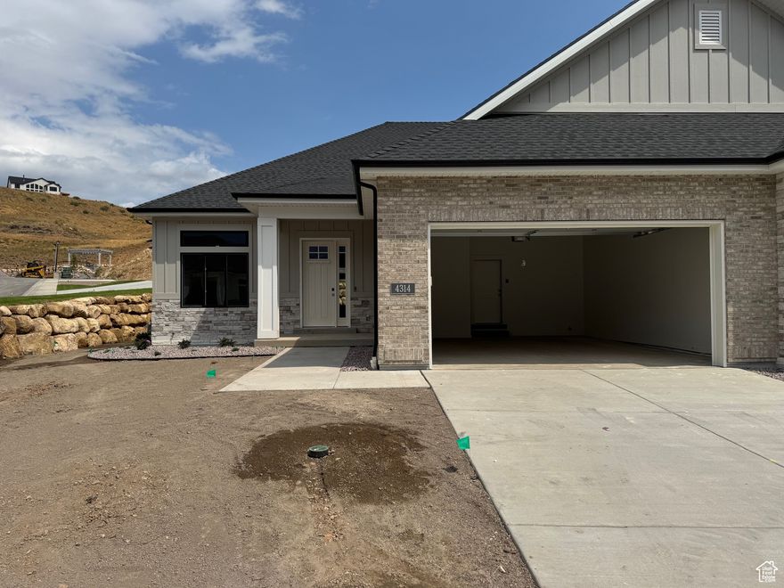La Ringhiera Development is a Luxury Twin Home Development high up in Traverse Mountain Lehi.  We are now in the final phase in the development, with this being the last Meriwood floor plan built.  You will be amazed with the high-end finishes throughout this home.  Main floor living includes 10' and 11' ceilings, with a tray celling in the main floor Family Room.  Entering this luxury home, you can feel the upgraded features that make this an exceptional home.   The beautiful chef kitchen cabinetry is a combination of stained white oak and painted cabinets, with stainless steel appliances including double ovens, microwave, dishwasher and 36" gas cooktop.  The two gas log fireplaces provide warmth on each level during the winter. The Primary Bathroom includes double sink vanity, standalone tub, and a separate shower finished with custom tile and Euro Glass Frameless Shower Enclosure.  The Primary Closet has a custom closet system with drawers and pull-down rods adding additional hanging space.   You will notice the conveniently located separate laundry room on the main floor.  The spacious basement includes a kitchenette with sink, microwave, and mini fridge, plus a large family room, two bedrooms, along with a 3/4 bathroom with upgraded tiled shower and Euro Glass Shower Door.  In addition, the basement includes a large bonus space under the double car garage, for storage or one can choose to finish as a home theater room or rec room.  This home also has a central vacuum system with all the tools and hose.  The garage is completely finished and includes an epoxy floor and insulated garage door.  Put away your lawnmower as the fully landscaped yard is maintained as part of the HOA services.  Snow removal to the garage door and front door is one of the best services provided in the winter.  Square footage figures are provided as a courtesy estimate from builder plans. Buyer is advised to obtain an independent measurement.