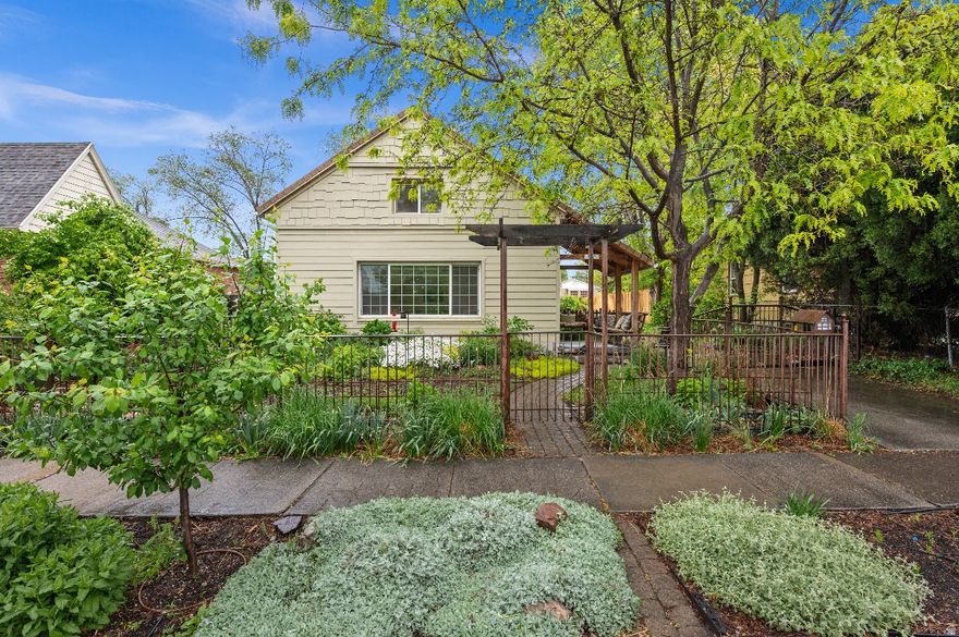 Step into a rare blend of historic charm and modern comfort in this beautifully updated two-story home, offering approx. 3,313 sq ft, 4 bedrooms, and 2.5 bathrooms. Originally built in the 1890s, this residence has been thoughtfully enhanced over the years-most recently with a complete kitchen and laundry remodel in 2024-creating a home that feels both timeless and truly livable. Natural light fills the home through bay windows, skylights, tall ceilings, and double-pane windows, creating a bright and inviting atmosphere year-round. A cozy fireplace adds warmth in colder months, while multiple living spaces provide flexibility for work, relaxation, and gathering. The fully remodeled kitchen is designed for both everyday living and entertaining, featuring new GE Caf appliances, a double oven, an induction cooktop, externally vented hood, beautiful green granite countertops, custom cabinetry, updated lighting, and a built-in water filtration system. The adjacent laundry room has also been completely renovated with custom cabinets, granite counters, a new washer and dryer, and convenient access to the wired and heated sunroom/greenhouse, perfect for year-round enjoyment and extending the growing season.  Above the garage, a fully equipped apartment with private entrance. It has a great room with lots of light, gas fireplace, updated kitchen with bar seating, a bathroom with steam shower, a stackable washer and dryer and its own mini-split HVAC system which offers ideal space for guests, multigenerational living, or rental potential. The backyard is a private retreat with mature landscaping, a tranquil waterfall, vegetable garden, and inviting outdoor living spaces-including an outdoor kitchen, fireplace, and pizza oven The koi pond with waterfall, garden beds and beautiful landscaping makes it an oasis -perfect for entertaining or relaxing evenings at home. Significant system upgrades include an updated electrical panel, high-efficiency boiler, mini-split AC/heat in the main home with 3 zones (and room to expand), new water softener, and updated sprinkler valves with an independent zone for the vegetable garden. Exterior improvements include a new south-side fence, regraded patio with pavers for proper drainage, and natural gas plumbed to the patio fire pit and a new garage door and opener. Walking distance to Liberty Park and just minutes to downtown or Sugarhouse, this home offers not just a place to live, but a lifestyle-complete with a welcoming neighborhood and vibrant community feel.  Square footage figures are provided as a courtesy estimate only.  Buyer is advised to obtain an independent measurement.