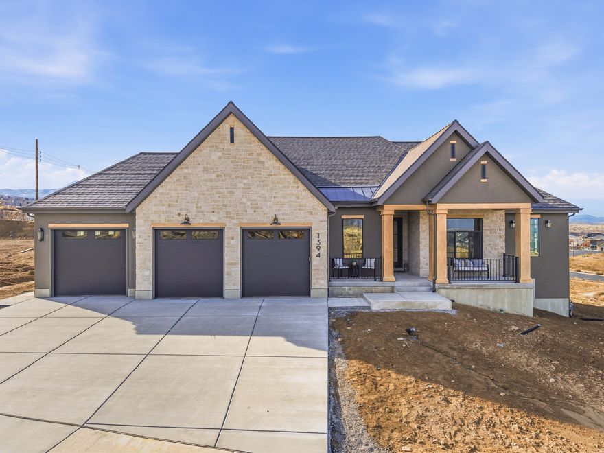 Discover refined luxury in this stunning new Salem home, crafted with high-end custom finishes and thoughtful design throughout. **Partially finished basement with large storage/bonus room, bedroom, and bathroom - rest of basement is unfinished and can be ADU or additional living space** The gourmet kitchen features premium Caf appliances, quartz countertops, and exceptional cabinetry and millwork. An oversized 3-car garage includes a convenient "Costco door" with direct access to the pantry for effortless grocery unloading.  The main floor showcases a spacious primary suite with a spa-like bathroom, custom closet layout, and designer finishes. A second bedroom on the main level functions as its own private suite-perfect for guests, multi-generational living, or a dedicated retreat. An impressive office with floor-to-ceiling views of the mountains creates an inspiring setting for work or creativity.  The bright, open layout flows seamlessly to a large covered deck with panoramic views across Utah County. The walkout basement is ready for a future 2-bedroom apartment or additional living space to grow into, with a patio that fills the lower level with natural light. This is luxury living with unmatched functionality-every detail carefully considered.