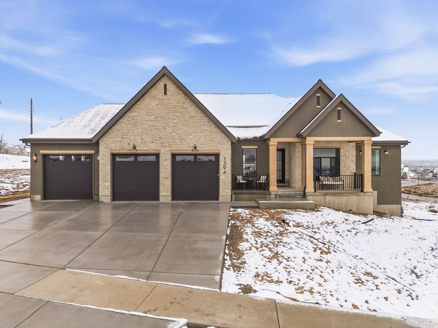 Discover refined luxury in this stunning new Salem home, crafted with high-end custom finishes and thoughtful design throughout. The gourmet kitchen features premium Caf appliances, quartz countertops, and exceptional cabinetry and millwork. An oversized 3-car garage includes a convenient "Costco door" with direct access to the pantry for effortless grocery unloading.  The main floor showcases a spacious primary suite with a spa-like bathroom, custom closet layout, and designer finishes. A second bedroom on the main level functions as its own private suite-perfect for guests, multi-generational living, or a dedicated retreat. An impressive office with floor-to-ceiling views of the mountains creates an inspiring setting for work or creativity.  The bright, open layout flows seamlessly to a large covered deck with panoramic views across Utah County. The walkout basement is ready for a future 2-bedroom apartment or additional living space to grow into, with a patio that fills the lower level with natural light. This is luxury living with unmatched functionality-every detail carefully considered.