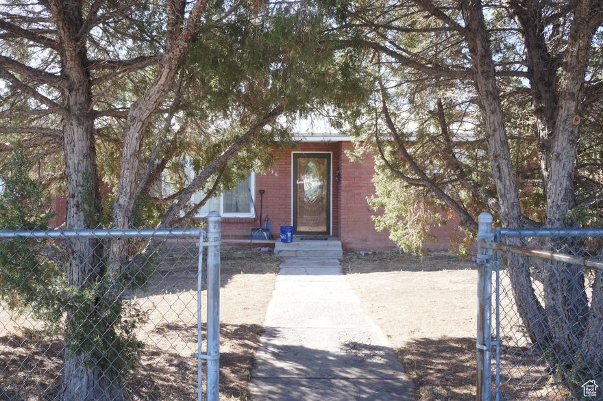 This mid-century rambler could use updating but it would be a great candidate for making the 2nd large living area w/ storage and concealed laundary facilities into a huge primary bedroom with possibly an on-suite bathroom.  Mature trees and a fully fenced yard provide privacy and shade. There's lots of potential here, and the sellers are motivated to help you make it happen!  Square footage figures are provided as a courtesy estimate only and were obtained from county records.  Buyer is advised to verify all information.