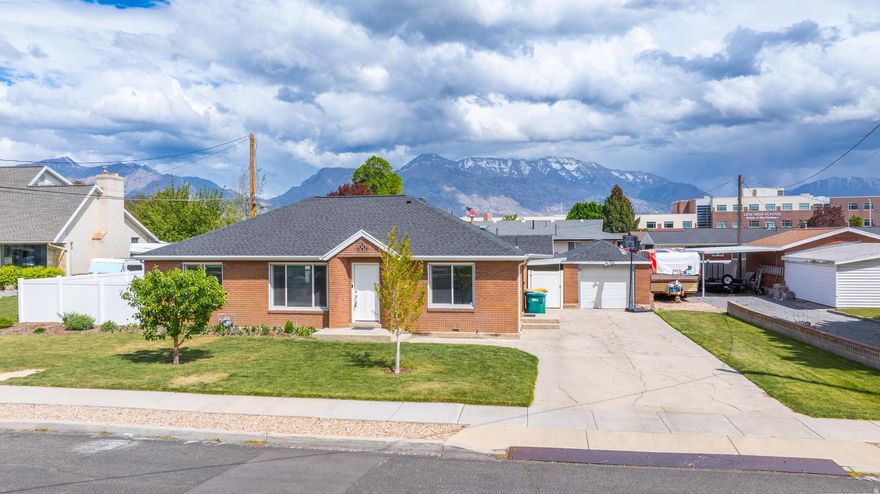 *** OPEN HOUSE SATURDAY 4-25-26 12PM-2PM*** This all-brick rambler sits on a quiet Lehi street and delivers the kind of easy, one-level living people wait for. 3 bedrooms, 2 bathrooms, and everything has already been taken care of-remodeled kitchen, updated bathrooms, and a newer roof (only 1.5 years old). No projects. No headaches. The layout is simple, functional, and just makes sense. Out back is where this home really shines. East-facing yard = cool shade all summer long (because nobody in Utah County is trying to bake outside in July). Fully fenced and private with a covered patio, mountain views, a large garden area, and mature fruit trees. Whether you're hosting, gardening, or just enjoying a quiet evening, this space delivers. You've also got RV parking and a detached garage-plenty of room for the toys, trailers, or that extra vehicle. Location? Exactly where you want to be. Quiet street, but just minutes to the freeway, shopping, and everything that makes Utah County... Utah County. Clean, updated, and ready to go. Homes like this don't sit around-schedule your showing before someone else beats you to it.