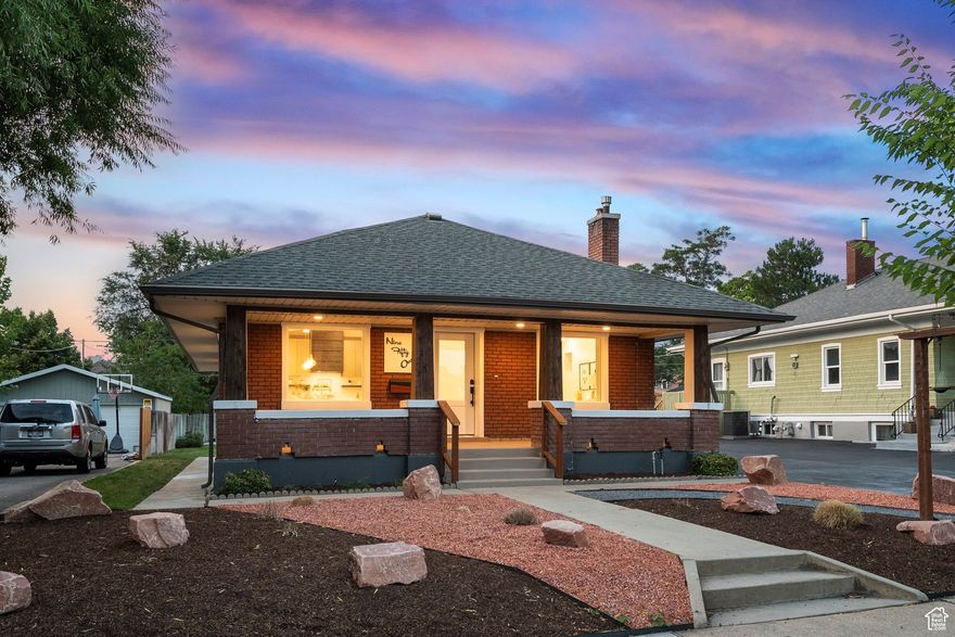 This comprehensively updated 1920s Sugar House bungalow, situated on a mature tree-lined street, is a showcase of modern living in a highly desirable, walkable neighborhood just steps from a vibrant business district with abundant shopping and dining options. The xeriscaped front yard and modernized porch lead into an interior thoughtfully reconfigured for highly functional one-level living. The open-concept design, immediately apparent upon entry, is enhanced by vaulted ceilings, an inviting office/music area, and a spacious living/great room that flows seamlessly into the gourmet kitchen. Awash in natural light, the kitchen is a chef's delight, featuring sleek Quartz countertops, modern cabinetry, stainless steel appliances, a striking professional-grade stove vent, a dedicated coffee buffet with pantry, and extensive additional storage. The private primary suite is a true sanctuary, boasting a luxurious his-and-hers waterfall shower with a euro glass surround, dual vanities, and a generous walk-in closet. Beyond the primary suite, a second bedroom with its own walk-in closet connects to a Jack-and-Jill full bath, also accessible to guests. A flexible laundry/mud room completes the main floor. The finished lower level offers additional living space, including a full bath, a versatile family/media room, a third bedroom with another walk-in closet, and secondary laundry and storage facilities. Beyond the visible upgrades, the home has been brought into the 21st century with all-new electrical systems, plumbing, and HVAC, and has been fully insulated for superior sound control and year-round comfort. Out back, residents will appreciate the well-maintained lawn and a good-sized garage.
