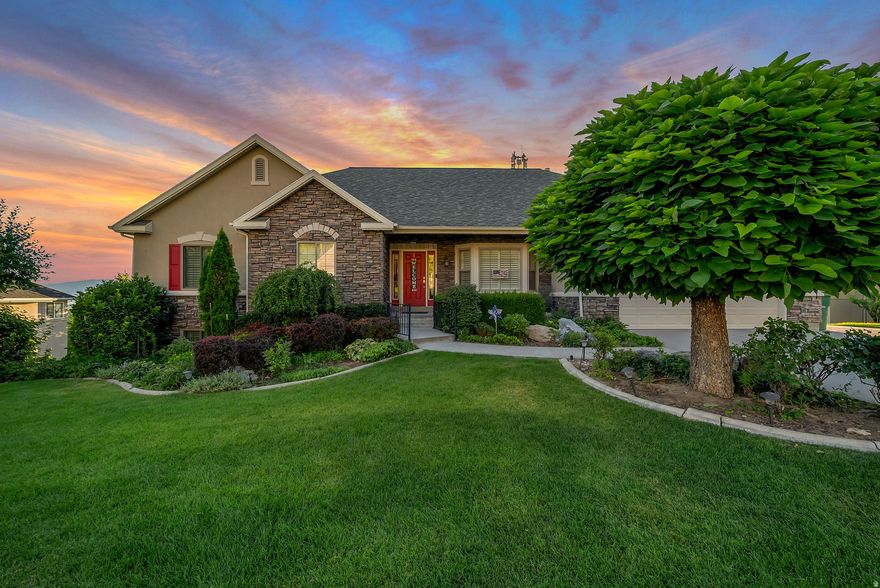 Enjoy Panoramic Mountain, Lake & Valley Views from Your Own Backyard Oasis Nestled in a prime Cedar Hills location with unbeatable views of Utah Lake, the Wasatch Mountains, and the entire valley, this beautifully maintained home offers the perfect blend of comfort, functionality, and scenery. Whether you're enjoying breakfast on the covered Trex deck or hosting a sunset gathering on the covered patio, you'll enjoy year-round beauty and privacy in your terraced backyard-complete with fruit trees (peach, apricot, nectarine). Step inside to 9-ft ceilings, plantation shutters, and several new Andersen windows that flood the home with natural light. The open floorplan includes a vaulted living room with a bay window, a spacious great room with a gas fireplace and built-in entertainment center, and a semi-formal dining area with wood floors and direct deck access. The kitchen features natural wood cabinetry, granite countertops, stainless steel appliances include gas range, dishwasher and built-in microwave. The kitchen also features a large island adding more cabinet and drawer space. A spacious double pantry in the hallway provides excellent kitchen storage, while the separate utility room offers added convenience with a gas washer and dryer, built-in sink, cabinetry, tile flooring, and a half bath. All major appliances are included-even the refrigerator. The primary suite is a peaceful retreat with a bay window bench, crown molding, walk-in closet, and private bath featuring an ADA-accessible jetted tub, separate shower, and tile floors. Two more additional bedrooms and a 3/4 bath compliment the main floor living space. Downstairs, the fully finished basement includes a large drop-down family room with gas stove fireplace and built-ins, a wet bar with convection stove/oven, and a separate walkout entrance to the backyard. You'll also find 3 additional bedrooms, an office/storage room, a full bath, and two generous storage areas-one with built-in shelves and cold storage, plus a large workshop with a double-door exit to the yard. The exterior features timeless stone and stucco, a welcoming covered front porch, and a finished 2-car garage with storage shelves, a ceiling hoist, keyless entry, and a side entrance. As a bonus there is an internet tower lease that provides high-speed connectivity ideal for working from home or streaming and pays you $35/month from the internet company. Plus programmable exterior lighting that changes colors for mutliple color arrangements throughout the year. This home is ideal for anyone who values comfortable living, functional space, and spectacular views-all in a location that offers peace, beauty, and convenience. Other upgrades-Leaf Filters on roof gutters, picture window installed over kitchen sink.