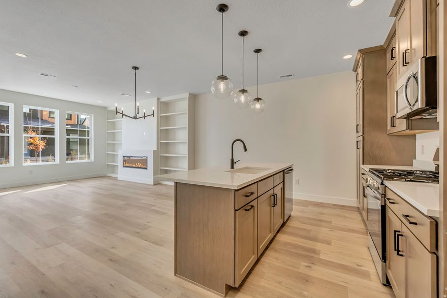 Step into the Solace floorplan-your cedar-clad courtyard retreat! Warm up by the fireplace surrounded by custom built-ins, take in the airy design with open railing, and host year-round gatherings on the half-covered deck. Whether it's summer evenings or crisp winter mornings, this home is made for comfort and connection.