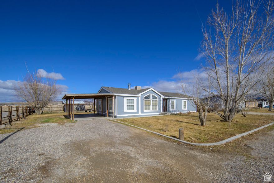 Charming rural retreat offering privacy and stunning views. The home features an open-concept living area, perfect for family gatherings. A standout addition is the oversized garage, ideal for storing your RV, boats, or creating a dream workshop. Whether you're looking for a peaceful country escape or space to pursue hobbies, this property offers the perfect blend of comfort and functionality. All information is provided as a courtesy estimate only. Buyer is advised to obtain an independent measurement/information.