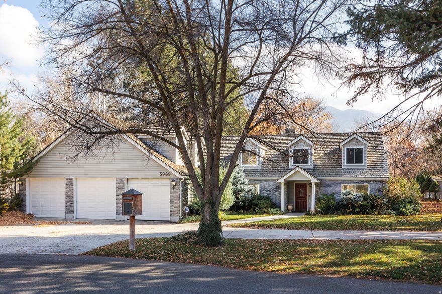 This gorgeous property boasts a charming exterior, spacious interior, incredible yard, and loads of potential. Set on over half an acre in one of the area's most sought-after pockets, this one offers the opportunity for a variety of visions, whether you choose to enjoy it as it is or make some thoughtful updates. With all square footage above grade and a generous footprint, you're at no risk of "over-building" in this enclave, so it's yours to sculpt. The original 1945 structure has been complemented by later additions, but plenty of charming original details remain, including a centrally located kitchen that anchors the floor plan and a cozy, centralized fireplace that beckons residents and guests alike. The home's standout feature is a stunning sunroom with vaulted ceilings and an incredible A-frame wall of windows that fills the home with natural light and frames views of the expansive and stunning grounds out back. There's room out there for whatever the next lucky owners can envision: this is a space for relaxation, play, gardening, gathering, and the like...and an existing sauna lends some retreat vibes. The oversized three-car garage and a private, dead-end street location provide both convenience and tranquility, but should you require some stimulation, you're very near Holladay city center and freeway access. We'd say this Holladay gem is ready for its next inspired chapter.Square footage figures are provided as a courtesy estimate only.  Buyer is advised to obtain an independent measurement.