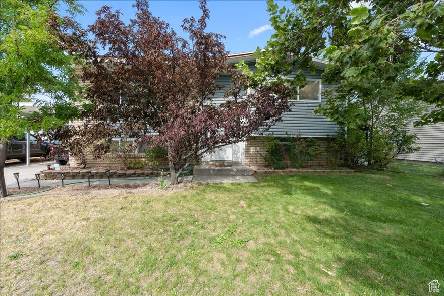 BACK ON THE MARKET FINANCING FAILED  Welcome to this charming Sandy home, perfectly situated on a quiet street with mountain views! Enjoy major upgrades already completed for you - including paid-off solar panels, new central air (2024), new dishwasher (2023), new furnace (2022), and a new roof (2020). The fully fenced yard features a new vinyl fence with double gates (2022)-great for pets, toys, or extra privacy. Inside, you'll love the warmth of the original hardwood floors and a layout ready for your personal touch. Home includes washer, dryer, fridge, and range-just move in and enjoy!    Square footage figures are provided as a courtesy estimate only and were obtained from public records.  Buyer is advised to obtain an independent measurement.