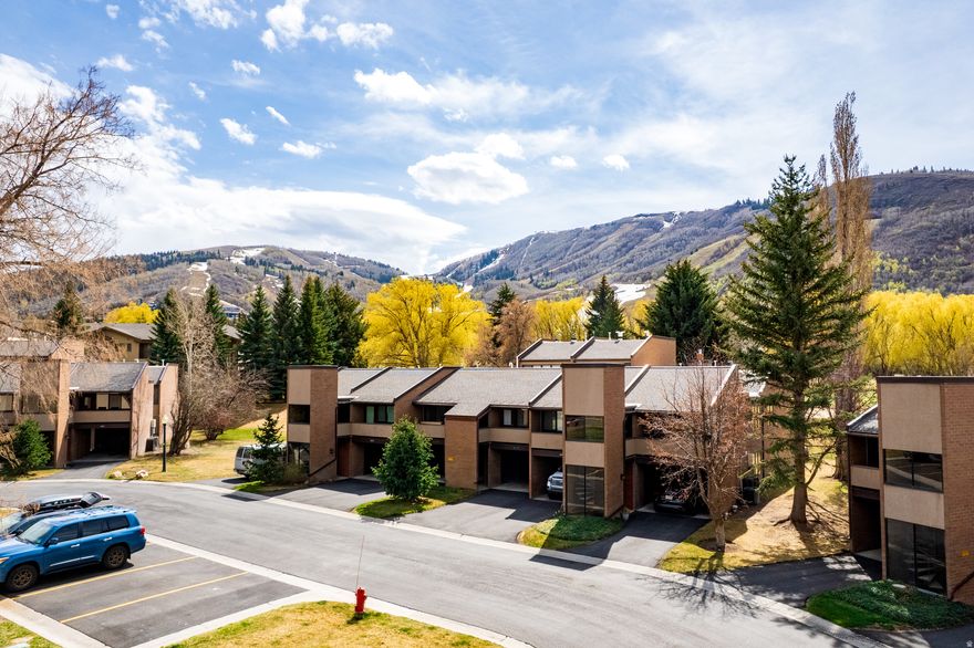 Experience the perfect blend of location, lifestyle, and investment potential in this beautifully remodeled Park Ave condo. Ideally, situated on the Park city, municipal golf course and just steps from the White Pine Nordic trail system, this single level residence offers year-round, recreation, right outside your door.  Completely remodeled in 2018 this condo features a clean, modern design and an open, functional layout that maximizes both comfort and style. Large windows invite in natural light while framing, peaceful views of mature trees, open green space, and surrounding mountains, creating a private, serene setting.  Located on the free bus route, this condo provides effortless access to Park City Resort, Historic Main Street and countless dining, shopping, and entertainment options. Walk to nearby grocery stores, ski shops, and community amenities including a community pool, clubhouse, and tennis courts, making it easy to enjoy everything Park City has to offer without needing a car.  With an attached carport and strong rental flexibility, this property is an exceptional opportunity for those seeking a low maintenance second home, a full-time residence, or a high-demand rental.
