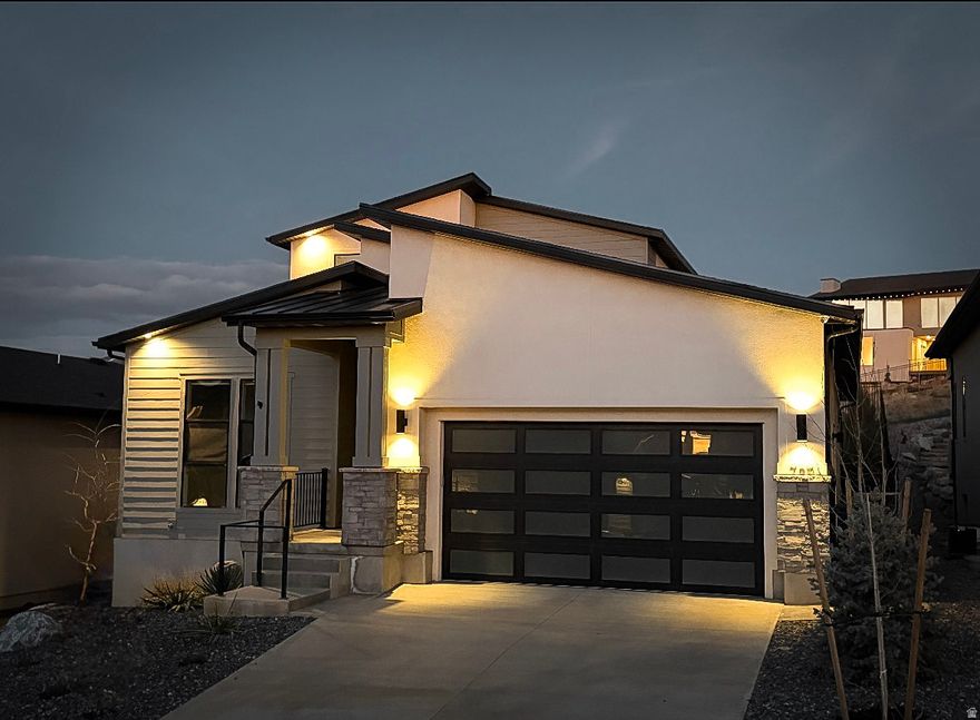 789 S. Miller Ave offers a rare blend of luxury, functionality, and income potential in one of North Salt Lake's most desirable locations. Built in 2021, this beautifully designed 5-bedroom, 4.5-bath home features over 4,200 square feet of thoughtfully crafted living space with high-end finishes throughout. The open-concept main level showcases a spacious gourmet kitchen with oversized island, granite countertops, custom cabinetry, stainless steel appliances, and seamless flow into the dining and great room areas-perfect for entertaining and everyday living. Expansive windows and upgraded stacking patio doors fill the home with natural light while capturing stunning mountain and valley views.  The luxurious primary suite includes a spa-inspired bath, oversized walk-in shower, dual vanities, and generous walk-in closet. Additional bedrooms offer excellent space and flexibility for family, guests, or home office needs. The fully finished basement includes a separate apartment setup with private living space, ideal for rental income, multi-generational living, or guest accommodations.  Situated on a premium lot backing to trails/open space, the property offers exceptional privacy and outdoor access while remaining minutes from downtown Salt Lake City, the airport, shopping, dining, and freeway access. Modern construction, energy-efficient features, abundant storage, and a highly functional floorplan make this home truly move-in ready. A rare opportunity to own a newer luxury home with versatility, views, and location all in one.
