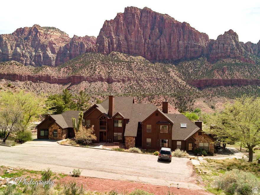 Experience the beauty of Zion National Park from this stunning, fully renovated condo! Enjoy breathtaking views from every window and both balconies. Priced below appraisal, this rare find includes a 1 car garage and HOA dues that cover most utilities. Inside, you'll find fresh paint, new hardwood and tile floors, and new carpet in the theater room (or 4th bedroom) and stairs. Bathrooms feature custom vessel sinks, granite counters, new faucets, mirrors, and glass doors. The primary bath boasts a Turkish tile shower with river rock flooring, rain shower head, and infinity glass doors. Furniture package available. Plenty of open space in the community. An incredible getaway!