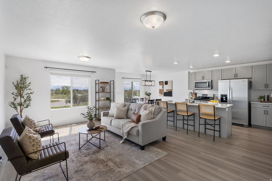 Ready to have Willow Park right in your backyard? With no rear neighbors, this townhome offers incredible, unobstructed views of the Wasatch Mountains, along with direct access to walking trails, nature, and a peaceful river setting-truly one of a kind. Step into a bright, open layout featuring modern finishes throughout and a like-new feel. The home boasts a spacious primary suite with dual walk-in closets, brand-new blinds throughout, and room to grow with an unfinished basement ready for your personal touch. Enjoy the convenience of a fully integrated smart security system, allowing you to control lighting, door locks, garage access, and more-all at your fingertips. Take in the serene scenery from your backyard, perfect for relaxing or entertaining, and enjoy access to the community pool and all the amenities the HOA has to offer. Please remove shoes.