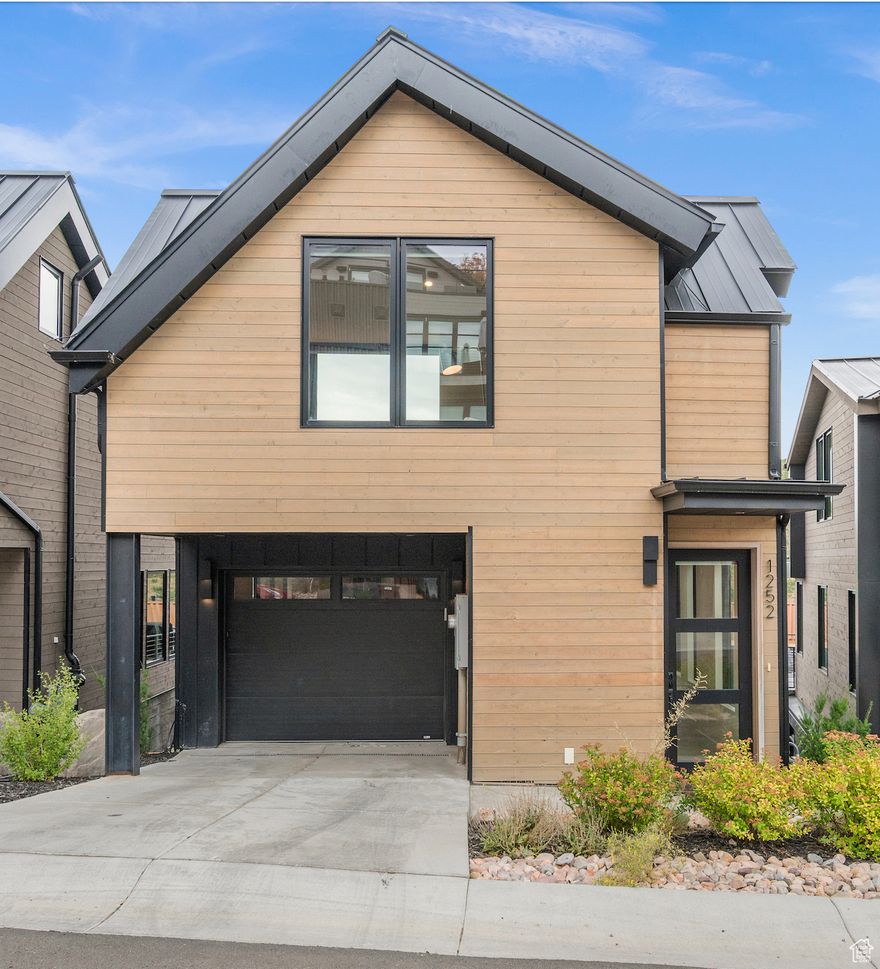 Step out your front door to find private access to Park City Mountain Resort. With a community tower for storing gear, an elevator leading directly to the slopes and a private bar for sipping cocktails, the Kings Crown subdivision provides its homeowners with the opulence and exclusivity one expects in Park City living. Next, come inside 1252 Rothwell Road and you'll see that luxury abounds in this mountain modern retreat. With four floors of beautiful design and high end finishes, this house is a family and entertainers dream. Upon entering through the front door you'll find an apr lounge with wet bar and a large heated deck featuring a gas fireplace and and a pretty view. Step down the floating staircase to the gourmet kitchen showcasing champagne colored quartz countertops and Thermador appliances. Your feet will glide on the European oak flooring equipped with radiant heat throughout. Socializing is a breeze with the great room offering a cozy fire, a large kitchen peninsula to gather and a dining table nearby. Enjoy restful nights in two luxurious suites, thoughtfully positioned at the top and bottom of the home. The one on the lowest level offers space and privacy, while the room on the highest level features a rooftop deck with hot tub and views. In addition to these two main bedrooms there is a third bedroom on the kitchen level and an ensuite flex room (currently being used as a fourth bedroom). Walk to Main Street shops and dining. Year round access to skiing, hiking, and biking in this epic location. Finally, for your comfort and ease, this house is provided fully furnished.  Square footage figures are provided as a courtesy estimate only and were obtained from tax records. Buyer is advised to obtain an independent measurement.