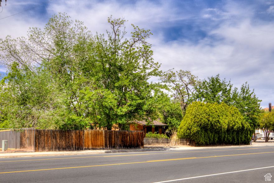 Endless possibilities in a downtown location! Make this home your own or a fabulous place for your business. Built in 1924, this property has character that can't be bought...hardwood floors, exposed brick...come inside and see for yourself. Large corner lot with plenty of outdoor space and room for parking. New roof in 03/2025.  C5 zoning offers many opportunities including professional offices, day care, restaurants, multi unit dwellings and much more. Information should be verified with the City of Moab.