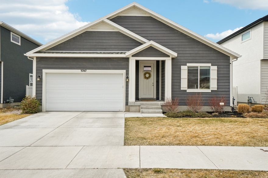 This immaculate rambler offers the ideal layout for effortless main-level living, tucked away in a quiet neighborhood with NO HOA. The main floor features vaulted ceilings and a spacious primary suite complete with a walk-in closet and en-suite bathroom, along with two additional bedrooms, a full bath, and a convenient laundry room. Downstairs, the fully finished basement expands your living space with a large recreation room featuring a custom built-in entertainment center, three additional bedrooms, a double-vanity bathroom, and abundant storage. Step outside to a fully fenced backyard with no current rear neighbors (area planned for future residential development), offering added privacy and open views. Conveniently located near shopping, everyday amenities, and with easy access to Eagle Mountain Blvd, this home combines comfort, space, and accessibility.