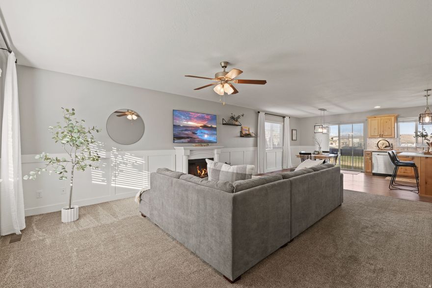 PRICE REDUCED! BRING AN OFFER! Welcome to this beautifully maintained home with stunning views overlooking the Ranches Golf Course and breathtaking views of the Wasatch mountains. Enjoy the ease of single-level living with an open, light-filled floor plan that's perfect for both everyday living and entertaining. The updated kitchen is sure to delight as it flows seamlessly into the main living areas creating a warm and inviting space for gatherings. The fully finished basement offers plenty of room for guests, hobbies, or a home office. Nestled in a quiet, serene neighborhood, this home provides the perfect balance of peace and convenience as it is located just minutes from everyday essentials and local favorites including Costco, FatCats, and Walmart. You'll love the accessibility without sacrificing tranquility.