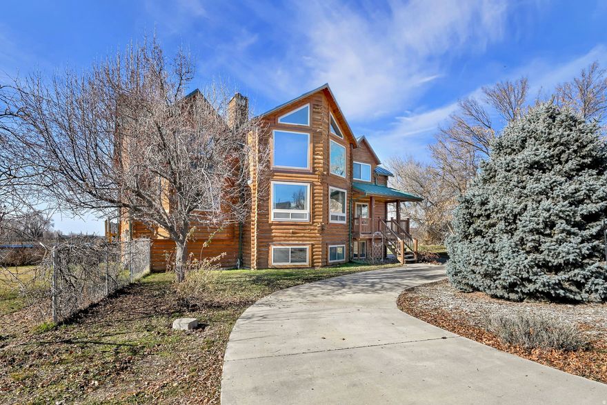 This stunning two-story cabin-style home offers an abundance of space and sits on a generous parcel of land, creating the perfect blend of comfort, charm, and opportunity. Located in the heart of Davis County, this property invites you to dream big and let your creativity run wild. Large windows throughout the home frame breathtaking views of the Wasatch Mountains, filling the space with natural light and scenic beauty. With the potential for a basement apartment, this home offers exciting income-property possibilities. Fresh paint and brand-new carpet make it easy to move right in and add your own personal style and finishing touches. Spend summer days lounging by the swimming pool with family and friends, creating memories that will last a lifetime. The oversized garage is ideal for extra storage, hobbies, or tinkering with your favorite toys year-round. With endless possibilities and room to grow, this property is ready to become the perfect homestead you've been dreaming of.  This Home is Easy to Show and Easy to Love.