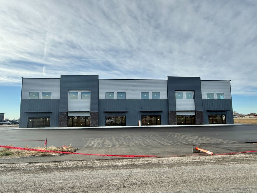 Position your business where it will be seen. This exceptional commercial building in Elwood offers incredible freeway signage and exposure along one of Northern Utah's most traveled corridors - the combined I-15 / I-84 stretch - delivering unmatched visibility and branding potential.  The building is constructed and ready for tenant improvements, providing a rare opportunity to customize the space to fit your exact operational needs. Designed with flexibility in mind, the property features tall ceilings, the ability to accommodate 14-foot overhead doors, and robust 3-phase power, making it ideal for industrial, flex, automotive, retail, service, or specialty commercial users.  One unit includes drive-through capability, offering unique functionality for businesses requiring efficient vehicle flow or customer access. The site provides ample parking with additional land available for expansion, outdoor storage, or future development.  Whether you're looking for a flagship location with freeway presence or a versatile commercial space ready to be tailored to your vision, this Elwood property delivers visibility, access, and scalability in one highly strategic location.