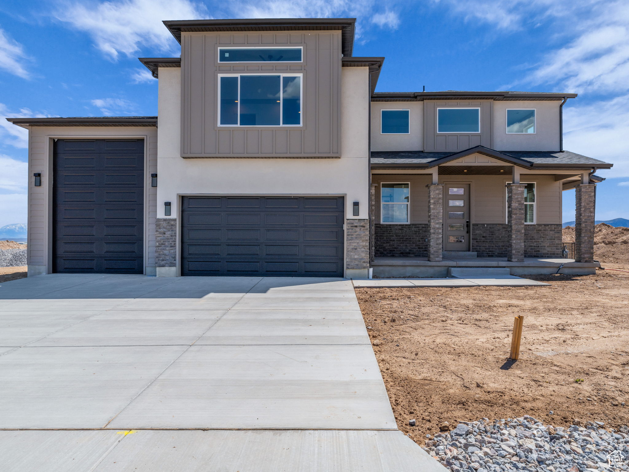 Beautiful brand new home with panoramic views of Cedar Valley and Pole Canyon. No HOA. Seller will pay up to $18,000 towards Buyers rate buy down or other closing costs. This home nestled on a spacious 1-acre lot. Designed for both comfort and functionality, this property features a 40'+ RV garage with oversized doors on both the front and back of the home perfect for toys, tools, and trailers. The owner's suite offers a true retreat with dual walk-in closets and ample space for relaxation. The unfinished basement is already rough-plumbed for a full apartment, giving you the flexibility to expand or create income potential.