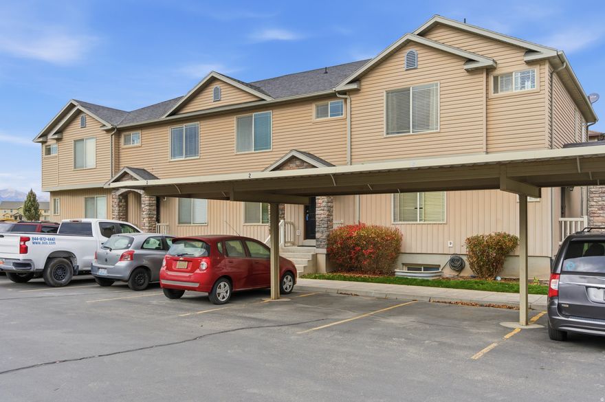 Beautifully maintained and thoughtfully updated 4-bedroom, 3.5-bath townhome located in the desirable Plum Creek community of Eagle Mountain right by The Ranches Golf Course. This move-in-ready home offers 1,889 sq ft. Inside, you'll find a spacious kitchen with a large dining area, new GE side-by-side refrigerator (2023), new GE oven and microwave (installed less than 3 months ago), upgraded kitchen lighting, and a generous pantry. The large primary suite includes double sinks, a walk-in closet, and a jetted tub. Additional updates include new Moen and Delta faucets in multiple bathrooms, new vinyl flooring in the upstairs bathrooms and half bath, all-new smoke detectors, fresh interior paint, and newly painted front and back exterior doors. Energy-efficient south-facing windows were recently installed, adding comfort and lower utility costs. The fully finished basement features a large family room, a full bathroom, a fourth bedroom, a laundry room, and a cold storage room under the porch-ideal for food storage or seasonal items. This home includes one covered carport with additional open parking available on a first-come basis, plus street parking. A large park sits just west of the building, and the location is within walking distance to Ridley's, Chevron, restaurants, and daily conveniences. HOA maintains landscaping, snow removal, and common areas for low-maintenance living. Great opportunity for an owner-occupant or investor. Buyer to verify all information.