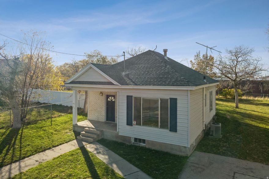 Fall in love with this charming 1914 bungalow nestled in the heart of Tooele! This 2-bedroom, 2-bath home features new carpet! Full bath upstairs, plus a convenient half bath in the partially finished basement and potential for two additional bedrooms or flexible living space in the basement. Outside, enjoy mature trees and big side yard and detached one-car garage. The yard is fenced along the sides and back, providing a nice balance of privacy and openness. Just a short walk east, you've got the Tooele Pioneer Museum / Pioneer Plaza at 47 E Vine St. The old Carnegie Library building is right there too (adjacent to the Museum), giving that vintage downtown charm. Need something quirky or vintage? Another Man's Treasures, at 14 W Vine St, is nearby for treasure hunters and local shoppers. A little bit west, the Tooele Applied Technology College (TATC) is in walking distance, bringing in student and local foot traffic. With mountain views, no HOA, this home is full of potential and ready for its next chapter.
