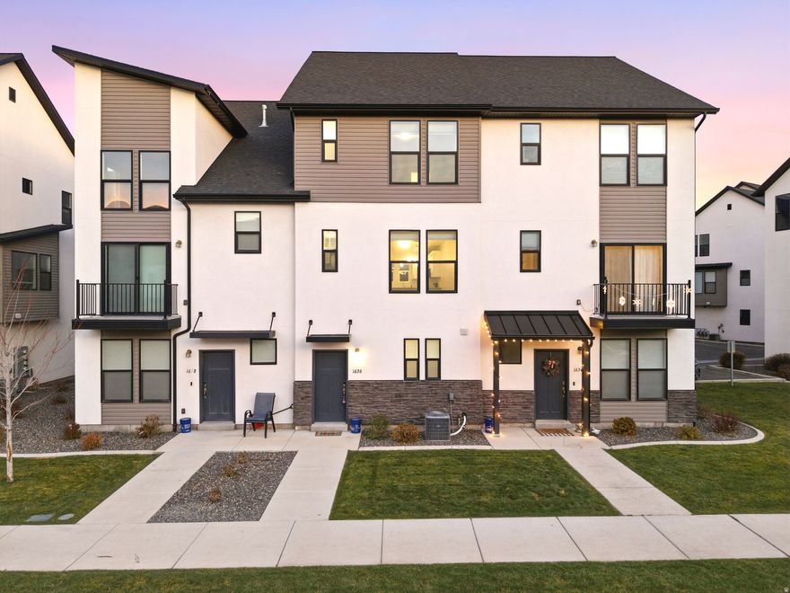 Welcome to this charming and well-kept townhome in beautiful Payson, Utah! This townhome offers comfort, convenience, and modern style-perfect for first-time homebuyers or anyone looking for a smart investment.  Both bedrooms feature their own bathrooms, making the layout ideal for roommates, guests, or a little extra personal space. It has an open-concept design with granite countertops, a spacious kitchen, and all appliances included-yes, even the refrigerator, washer, and dryer- so you can move right in with ease.  You'll appreciate the thoughtful upgrades, including additional shelving in the 2-car garage for organized storage. The location is a standout too: just minutes from freeway access, local parks, and great schools, offering a perfect blend of convenience and community.  Don't miss the chance to make this cute, comfortable Payson townhome your own!  (Living room has been virtually staged)