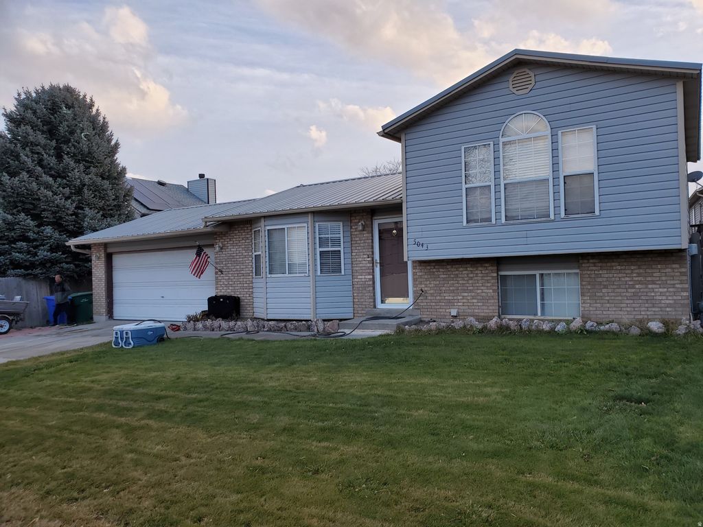 Photo of 5043 W TICKLEGRASS RD, West Jordan, UT 84081 (MLS # 2127700)