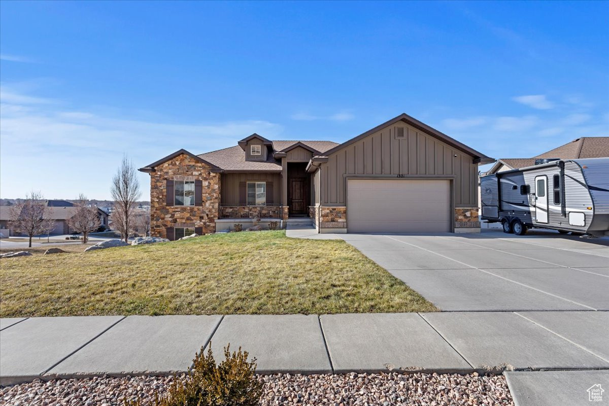 Located in the coveted Kotter Canyon Subdivision, this custom-built gem is perched on the bench with STUNNING panoramic views of the valley and mountains.  Step into this thoughtfully designed home featuring an open-concept layout with soaring vaulted ceilings, a welcoming great room, and exquisite cabinetry throughout. Granite countertops grace every surface, adding a touch of elegance to the kitchen and bathrooms. The kitchen seamlessly flows into the dining and living spaces, with direct access to a large covered deck. This outdoor haven, complete with a built-in gas line for grilling, is perfect for entertaining or simply soaking in the breathtaking views in a neighborhood renowned for its beautifully manicured homes and yards.  One unique opportunity for the savvy buyer lies in the unfinished basement. This blank canvas invites you to create the space of your dreams-whether it's a home theater, additional bedrooms, a fitness area, or the ultimate entertainment zone. The possibilities are endless, and the choice is yours!  Square footage has been taken from an appraisal, and buyers are encouraged to verify.  Don't miss the chance to own this incredible home and make it uniquely yours! Schedule your private showing today!