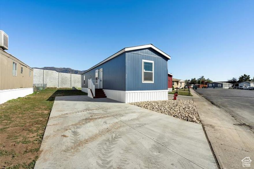 This 800-square-foot manufactured home in Mountain View Estates features two bedrooms and two bathrooms. Built in 2023, this modern home boasts an open-concept living and dining area, perfect for entertaining guests or relaxing with family. The sleek design includes updated fixtures and finishes throughout, creating a comfortable and stylish living space. With plenty of natural light streaming in through the windows, this home offers a cozy retreat for its residents.  Mountain View Estates in Layton, UT, is a vibrant community offering a range of amenities for its residents to enjoy. From a clubhouse for social gatherings to a fitness center for staying active, there is something for everyone in this community. The well-maintained grounds feature walking paths and green spaces, providing a peaceful environment for residents to relax and unwind. Mountain View Estates is the perfect place to call home with easy access to nearby shopping, dining, and entertainment options.