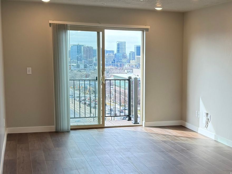 Unobstructed SLC skyline and sunset views from this coveted 5th floor 2 bed/1 bath corner unit.  BRAND NEW condo - Building B was fully rebuilt with 32 documented upgrades including seismic reinforcement, soft-close cabinets, upgraded countertops, kitchen island, stainless appliances, dimmable lighting, and Trex deck.  PRIME LOCATION only 3 blocks to the U of U, steps from TRAX, minutes to downtown and the Medical Complex.  WELL RUN HOA $245/mo covers water, sewer, trash, exterior insurance, pool, gym, and on-site management.  COVERED PARKING, secure building, smart package lockers. Long-term rentals permitted. Google Fiber available. Broker has ownership interest.