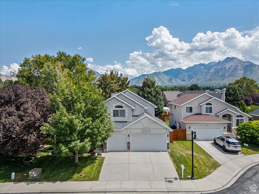 Nestled in a quiet cul-de-sac in one of Millcreek's most desirable neighborhoods, this carefully maintained home blends style, comfort, and functionality. The main floor features a modern open-concept layout with a soaring 20-foot vaulted ceiling. Natural light fills the living room, breakfast nook, and generously sized family room - creating a warm and inviting space for everyday living. The primary suite is conveniently located on the main level, while three large bedrooms are upstairs. The basement has two additional bright bedrooms as well as a stylish wet bar and flexible space ideal for home gym and media room. Outside, a large patio in the private, tree-lined backyard is perfect for relaxing or entertaining. In addition, a 3-car garage offers ample room for parking and storage.  The 2025 remodel makes the home move-in ready. It includes new luxury vinyl plank flooring on the main level, new carpets upstairs and in the basement, upgraded bathrooms, and all new light fixtures. The main bathroom was renovated with a sleek, modern European-style shower. The additional upgrades in recent years provide high-end quartz countertops, electric range, and fresh paint throughout the home.   The home is close to shopping, schools, parks, freeway, healthcare centers and the new Millcreek Commons. It also has quick access to the airport, canyons and nearby world-class ski resorts. Homes in this community tend to sell fast - schedule now before it is gone. Buyer to verify all information.