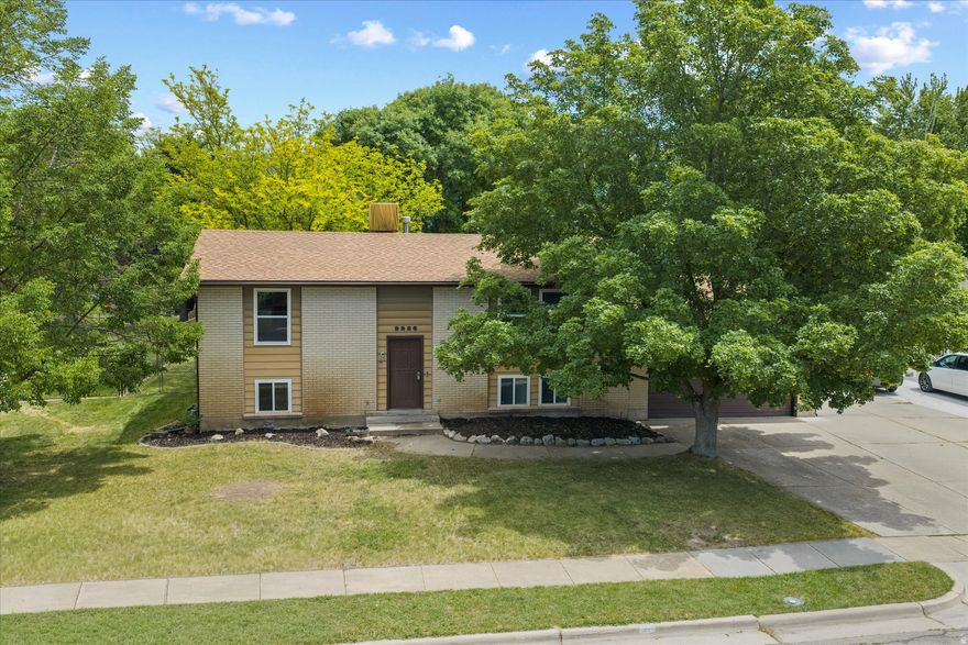 This spacious 4-bedroom home features a large backyard ideal for entertaining, with mature shade trees, a spacious deck, a separate patio for games, family gatherings, or a future hot tub, with electrical outlets throughout the yard. Inside, you'll find two family rooms, an exercise area, and cable coaxial outlets in every room. Additional highlights include an extra-length garage, RV parking, a walkout basement, security system, smart thermostat, and Ring doorbell. Major recent updates include a new furnace, A/C, water heater, and roof. Located in a friendly neighborhood close to shopping,  this home offers comfort, convenience, and versatility. All information  herein is deemed reliable but is not guaranteed. Buyer is responsible to verify all listing information.