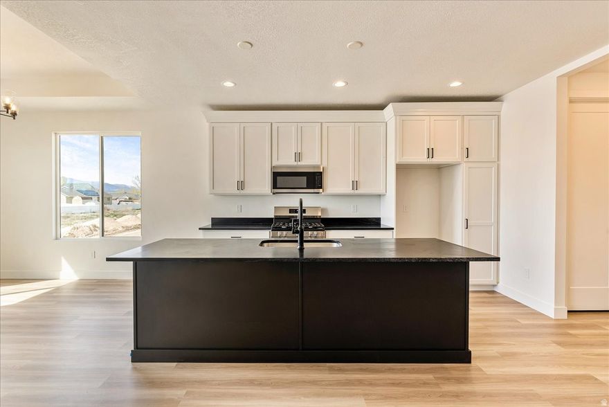 Fantastic opportunity to own a newly framed 3-bedroom, 2-bath home set for completion by the end of February! This property also features an unfinished basement, providing endless potential for customization. Nestled in the desirable Eagle Mountain area, it offers stunning views and a welcoming community.