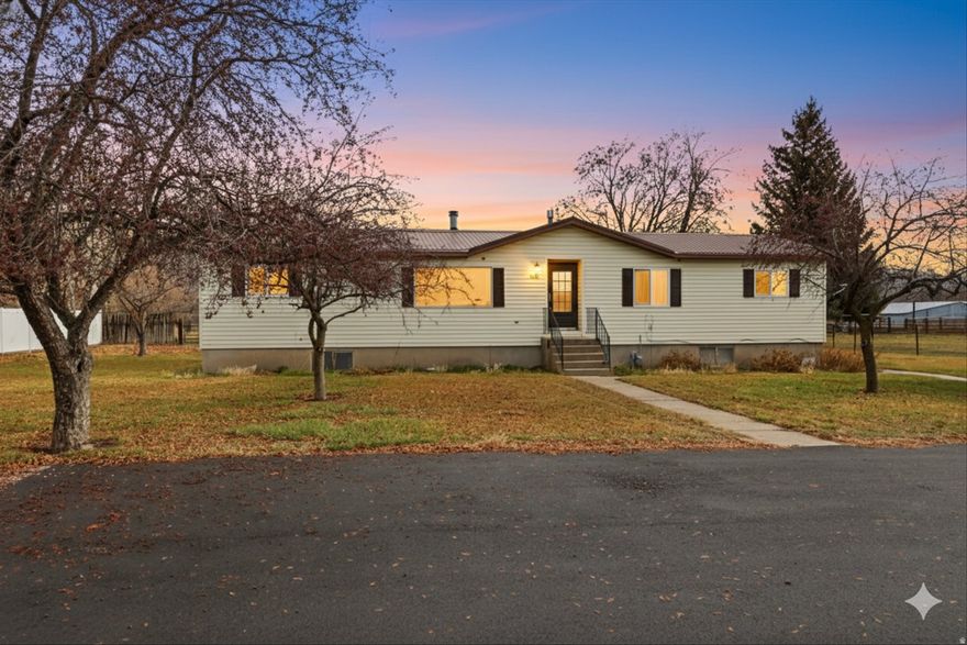 Step back in time and imagine the possibilities with this classic ranch-style time capsule home set on 1.74 fully fenced acres, perfectly suited for horses, livestock, and wide-open country living. This is the kind of property that's getting harder to find-usable land, solid bones, and space to breathe.  The home proudly reflects its original character, offering a nostalgic charm that's both warm and welcoming. Whether you love the retro vibe or see it as a blank canvas for a thoughtful update, the layout is functional and full of potential. Single-level living provides ease and comfort, with generous room sizes and natural light throughout.  Outside is where this property truly shines. Part of 1.74 acres is fenced, making it ideal for horses, goats, chickens, or your next livestock dream. Plenty of room for corrals, gardens, a shop, or future improvements-this land works as hard as you do. Bring your animals, your equipment, and your vision.  The ranch setting offers privacy and a peaceful rural feel while still being within convenient distance to town amenities. Whether you're looking to homestead, start a small hobby farm, or simply enjoy open space and fresh air, this property delivers flexibility and freedom.  This is more than a house-it's an opportunity. A chance to own land, preserve character, and create something special. If you've been searching for a true horse property with room to grow and a home full of history, this one deserves your attention.  Classic. Livable. Full of potential. Welcome home. Sale to include second parcel #04-083-0063 of the 1.24 acres.
