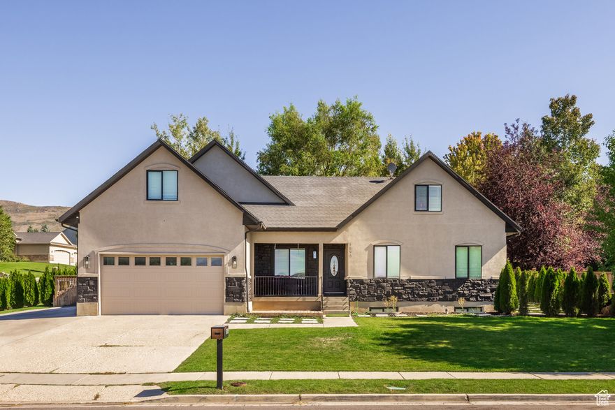 Enjoy incredible views of the Wasatch Back, including Mt. Timpanogos, from this beautifully updated Heber City home. With a park right across the street, the location is hard to beat. Inside, you'll find modern upgrades throughout, including quartz countertops, LVP flooring, and quality appliances. The basement offers a rental-ready setup with a separate entrance, creating flexibility for additional income or extended living space. Step outside to a large deck where you can relax or entertain, complete with a gas fire pit-perfect for soaking up the breathtaking mountain views year-round. Conveniently located with quick access to HWY 40, you'll be minutes from all that Heber, Midway, and Park City have to offer-world-class skiing, golf courses, lakes for boating and fishing, plus endless opportunities for snowmobiling, ATV riding, and more.