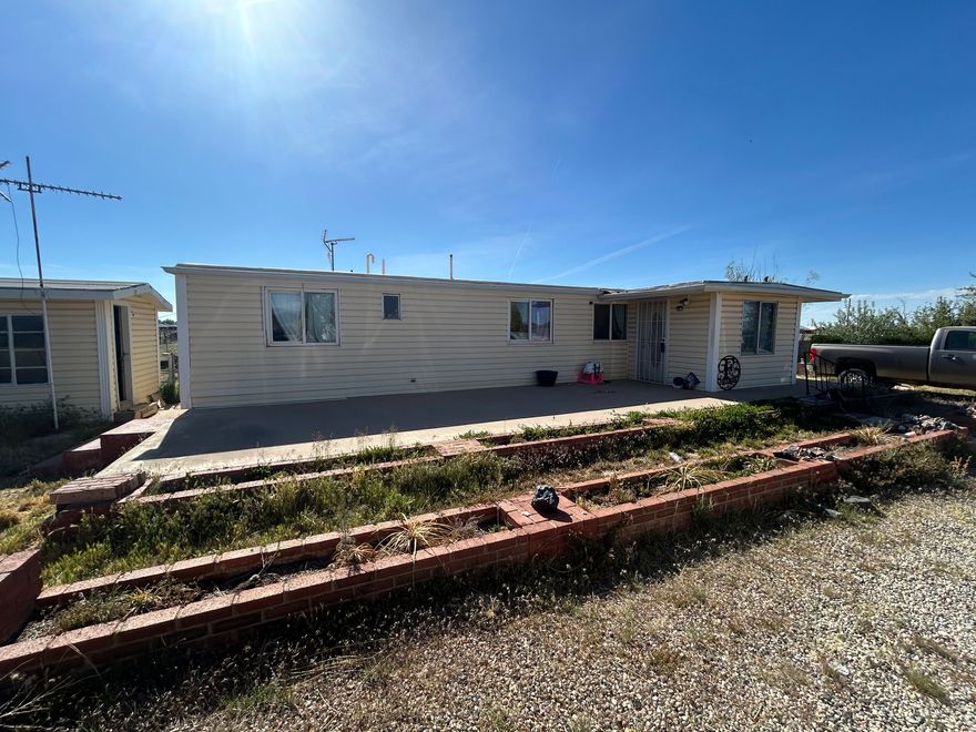 This recently renovated manufactured home gives you a great location, with the opportunity to develop the land.   It is on a 2.27-acre fully fenced lot, which is zoned R2, giving the opportunity for future investments, along with the opportunity for livestock and homesteading-type hobbies. This property also includes a shed that has electricity. The roof was replaced in 2020, and the appliances that were replaced last year are negotiable. This home is on a shared well, which is $150 a quarter or $600 a year.