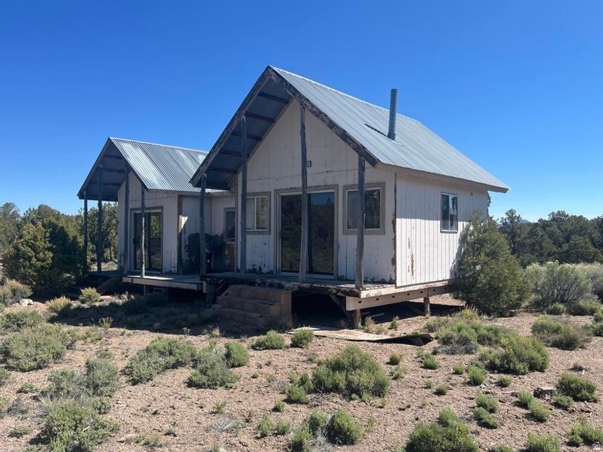 Very rare 20 acres in Hamlin Valley!! Property comes with a small home that was built in 1997 that is 560 sqft that needs completed. Home is currently run on a generator. No water rights or well on property. There is a big water tank next to the home.