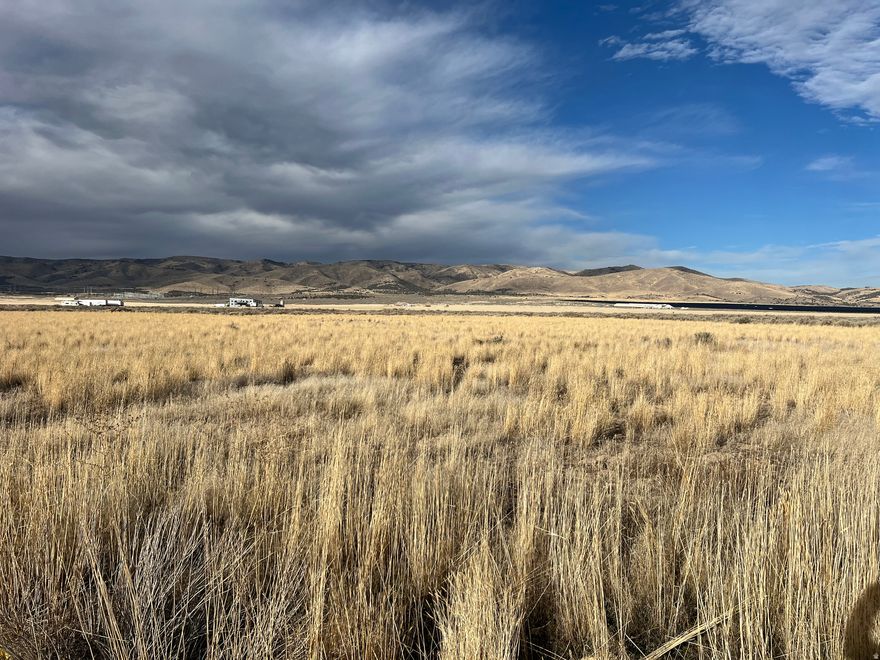 Beautiful 10-acre property comprised of two parcels, offering stunning views of Mt. Nebo and close proximity to the nearby reservoir. Conveniently located just 2 minutes from freeway access, 10 minutes to Nephi, and 15 minutes to Payson. County zoning allows for one single-family residence only; the property cannot be subdivided. Includes 1.5 water shares, sufficient for residential use, with a shared well serving six homes. Water and power are stubbed to the front of the lot. Septic system and propane required.