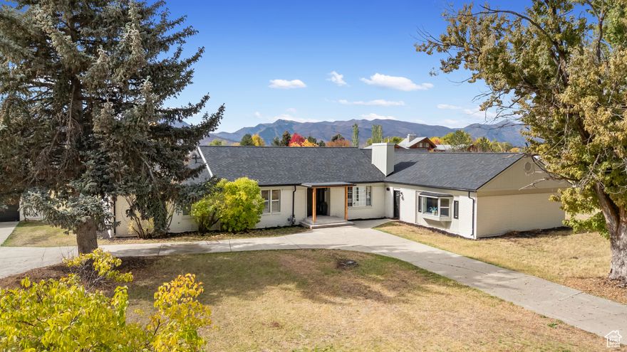 Don't miss this rare opportunity to own a beautifully updated horse property just minutes from Snowbasin, Nordic Valley, and Powder Mountain ski resorts. Perfectly located for year-round adventure, you're also only minutes from Pineview Reservoir-bring your boat and enjoy world-class fishing, boating, and recreation.  This stunning single-level home boasts an open-concept floor plan designed for comfort, entertaining, and unforgettable mountain getaways. A private guest quarters with its own entrance features a spacious bedroom, kitchenette, and full bathroom-ideal for visitors, extended family, or potential rental income.  Recently renovated with premium finishes, this home also includes a new roof, tankless water heater, and numerous upgrades throughout. Generously sized bedrooms offer abundant storage and natural light.  Step outside to a large Trex deck that overlooks an expansive backyard-plenty of room for horses, gardens, or future outbuildings. Soak in panoramic mountain views in every direction.  An oversized detached garage, circular driveway, and ample parking make it easy to accommodate trailers, RVs, and all your outdoor toys.  This property truly offers the perfect blend of rural charm, modern convenience, and access to the best of Utah's outdoor lifestyle.