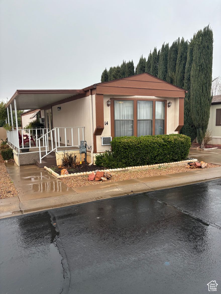 **WE HAVE FINANCING OPTIONS FOR THIS PROPERTY**   Discover this well-maintained 1992 Nashua home, showcasing pride of ownership in the desirable Paradise Palms 55+ community. The HOA fee covers lot rent, basic cable TV, and common area maintenance, ensuring a hassle-free lifestyle. Home Features: Thoughtfully designed 2-bedroom layout, with bedrooms located on opposite ends for added privacy. Tandem 2-car carport plus a storage shed for extra convenience. Low-maintenance yard, perfect for seasonal or full-time living-no lawn mowing required! Prime Location: Minutes from shopping, medical facilities, restaurants, and scenic walking trails. Important Details: ALL buyers must be HOA-approved before the seller can consider an offer. Property taxes are handled through the Utah State DMV. A wonderful opportunity for stress-free, affordable living in a welcoming community! Contact us today for more details or to schedule a showing. Information deemed reliable, however buyer to verify all information including utilities, rental restrictions, and HOA information if applicable.