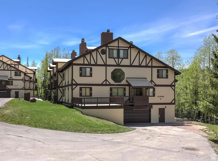 Welcome to this stunning condo, offering a perfect blend of comfort and space for large families or groups. The main floor boasts an open-concept living area with vaulted ceilings, a bright kitchen equipped with stainless steel appliances, and a large bedroom with a full bathroom. Natural light floods the space through expansive windows, creating a warm and inviting atmosphere.  Step outside through the sliding doors in the living room to enjoy your private deck with tranquil, scenic views. Upstairs, you'll find two generously sized bedrooms and another full bathroom, while the top level is reserved for the luxurious master suite, complete with a private master bath. Additional amenities include a basement garage with parking to protect your vehicle, a ski locker, firewood, and onsite laundry facilities-all covered by HOA dues. Nestled in a serene aspen grove, the Alpine Condominiums offer a peaceful retreat while being centrally located. In summer, explore nearby hiking and biking trails, streams, and forests, or visit the town pond for fishing. In winter, take advantage of the shuttle service for easy access to the ski resort, located just a mile away. This condo provides everything you need to settle into your ideal mountain home, offering both convenience and relaxation in one beautiful package.