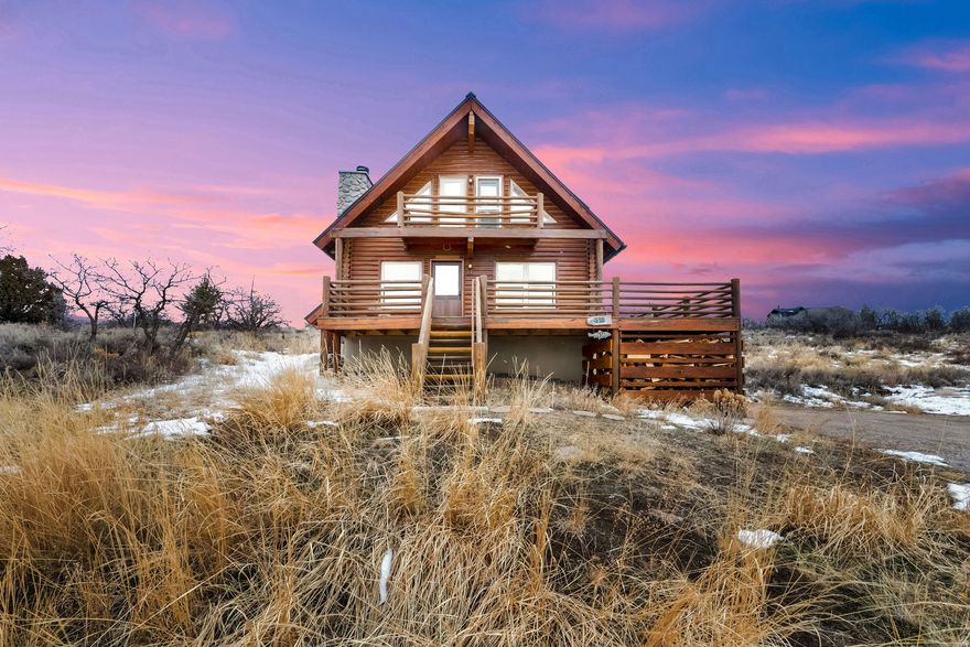 Nestled on nearly 3 acres of pristine mountain property, this charming log cabin has been exceptionally upgraded with "off-grid" features offering incredible mountain living and ultimate preparedness. Interior finishes balance durability and comfort with new wool carpet in the bedrooms, hand-made Heath ceramic tile flooring on the main level and include brand new washer and dryer. Power reliability is unmatched with a cutting-edge off-grid system with dual EG4 6000XP inverters running in parallel, a 32kW / 600 amp-hour battery pack, and a 5kW solar array clipped directly to the brand new metal roof with added insulation, currently wired in standby mode to preserve capacity. A new 22kW generator connected to a 1,000-gallon propane tank and protected by a newly built shed roof shared with the new Bryant 16-SEER AC unit. Comfort and efficiency are elevated by a top-of-the-line Bryant modulating furnace with UV light and MERV-11 filtration, on-demand water heater, and a brand-new high-efficiency wood stove tastefully set into a beautiful limestone fireplace capable of heating the entire home independently. This mountain retreat has been fully re-piped with PEX-A, and features a new whole-house sub-0.5 micron filtration system with reverse osmosis. Additional upgrades include steel gutters with heat tape and snow bars designed to melt snow and feed water into storage, a high-R-value insulated garage door with LiftMaster opener, and a fully upgraded and serviced septic system. Sauna, firewood and a 27-ton wood splitter are all included, making it immediately functional as a secure weekend retreat or full-time residence.(UTV 2025 Can - Am Defender with plow and snow tracks negotiable). Surrounded by expansive Wasatch Back and Heber Valley views, abundant wildlife, and endless year-round recreation, yet still within easy reach of local amenities and under an hour to the Salt Lake City International Airport, this is a truly rare opportunity to own a fortified, off-grid-ready mountain property built for independence, resilience, and peace of mind. This cabin has all the high-end systems designed for cozy long-term self-sufficiency in the beautiful mountain scenery!