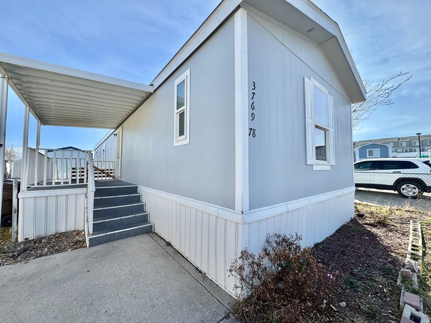 Move-in ready mobile home featuring 3 bedrooms and 2 bathrooms. The home includes a gas range, flooring throughout, and a spacious yard. Square footage figures are provided as a courtesy estimate only; buyer is advised to obtain an independent measurement.