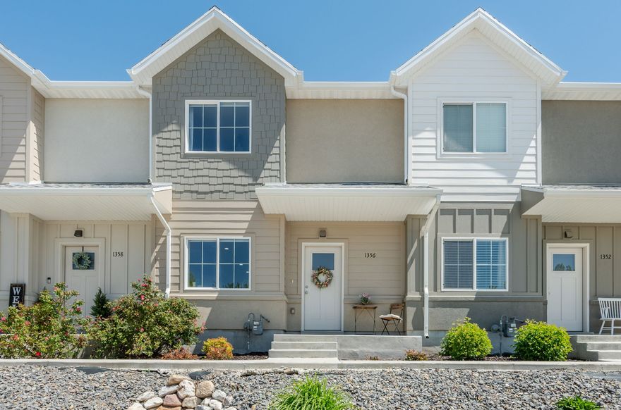Beautiful newer townhome in a highly desirable Sunset community, ideally located next to Sunset City Hall and backing to a quiet city park. This well-designed 3-bedroom, 2.5-bath home offers approximately 1,345 sq ft of comfortable living space with a functional, open layout and modern finishes throughout. The main level features stylish LVP flooring, granite countertops, ample cabinetry, and a spacious kitchen with pantry. The living area is inviting and well laid out, perfect for everyday living or entertaining. Upstairs you'll find all three bedrooms along with a convenient full laundry room. The property includes a 2-car garage with additional driveway parking, plus nearby guest parking. The setting offers both convenience and a peaceful neighborhood feel, with the park directly behind the home providing open space and added privacy. Located just minutes from I-15, Hill Air Force Base, Weber State University, Ogden Regional Medical Center, and a variety of shopping, dining, and recreation including Lagoon and Farmington Station. Easy access to multiple highways makes commuting simple in any direction. Buyer to verify all information, including square footage.