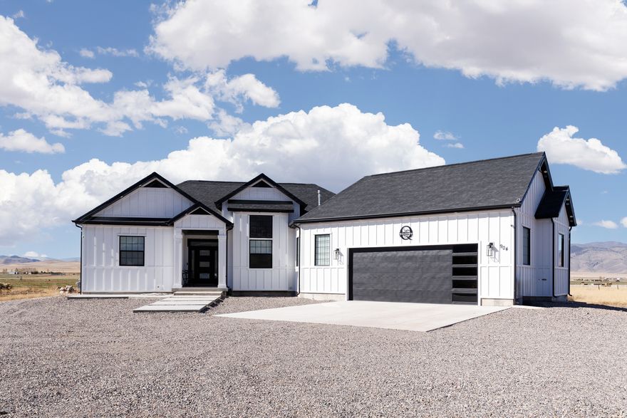 Modern farmhouse on a quiet dead-end street with stunning mountain and valley views. This 3 bed, 2 bath home features vaulted ceilings, an open floor plan, beautiful countertops, custom cabinetry, tiled backsplash, and a spacious island. Quality finishes throughout with an oversized garage.